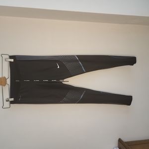 Nike black and blue leggings in Small.